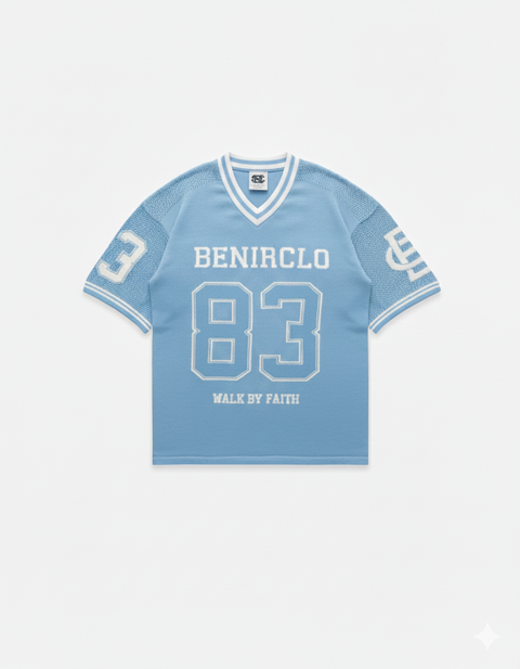 Benir Clothing light blue knit jersey with white 83 graphic, V-neck collar, and Walk By Faith text on front.